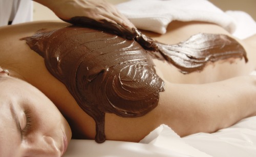 cacao therapy applied to young woman in a spa